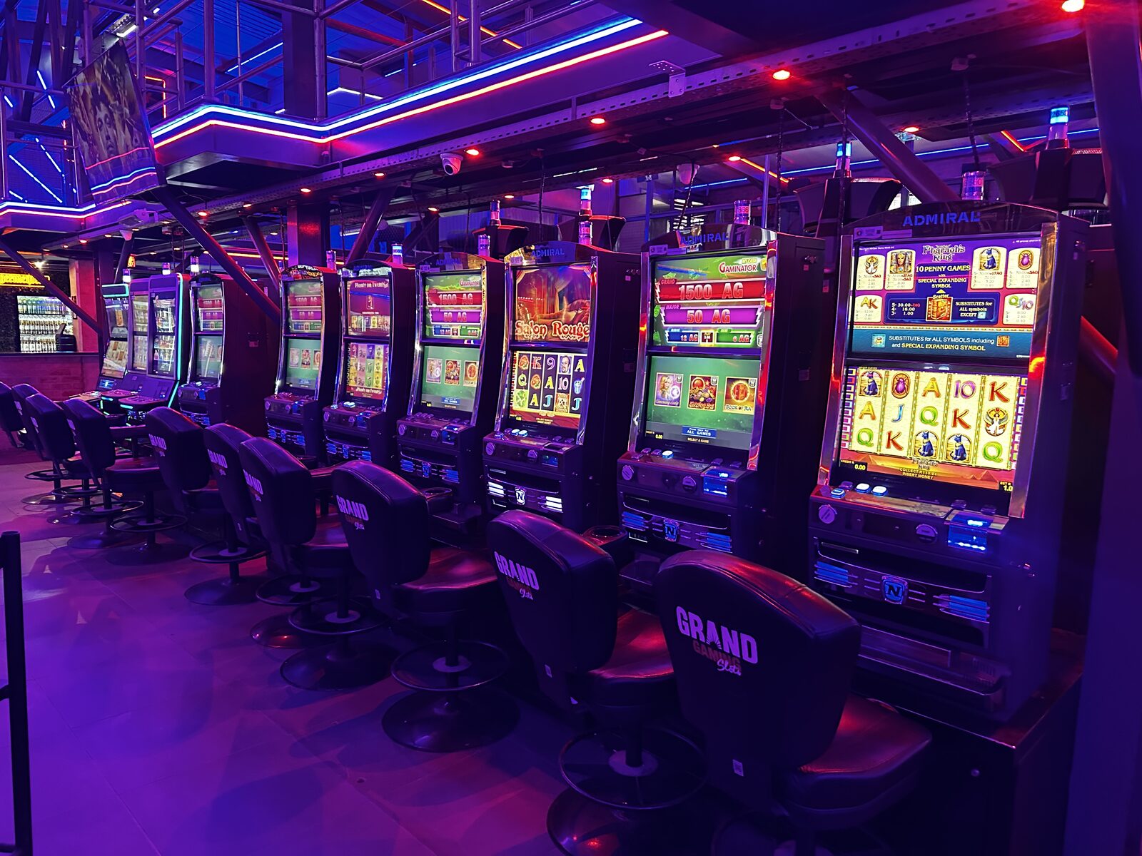 Row of Admiral and Novomatic slot machines on the gaming floor at Cheeky Tiger Midrand