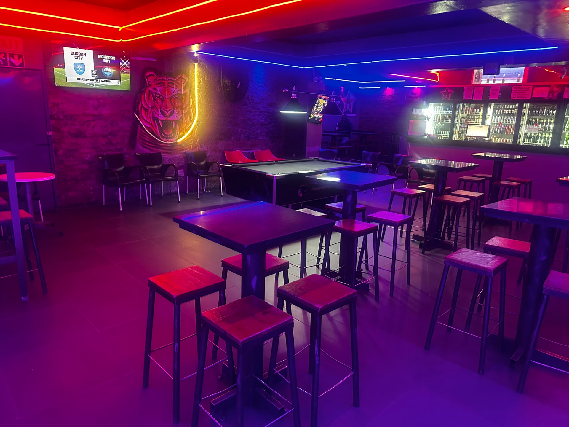 Tiger mural and pool tables at Cheeky Tiger Bree Street