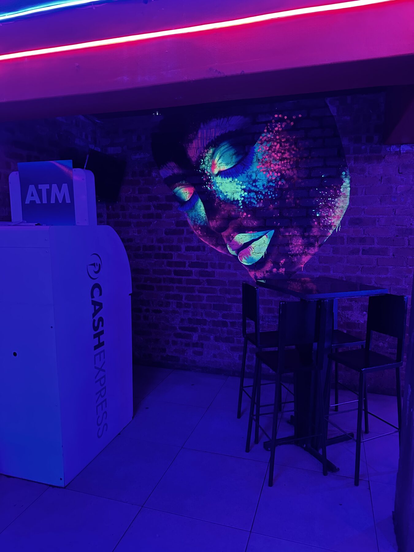 Cash Express ATM beside the UV face mural at Cheeky Tiger Diepkloof Hotel
