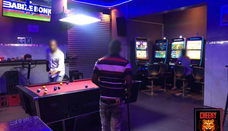 Pool table and slot machines at Cheeky Tiger Noord Street