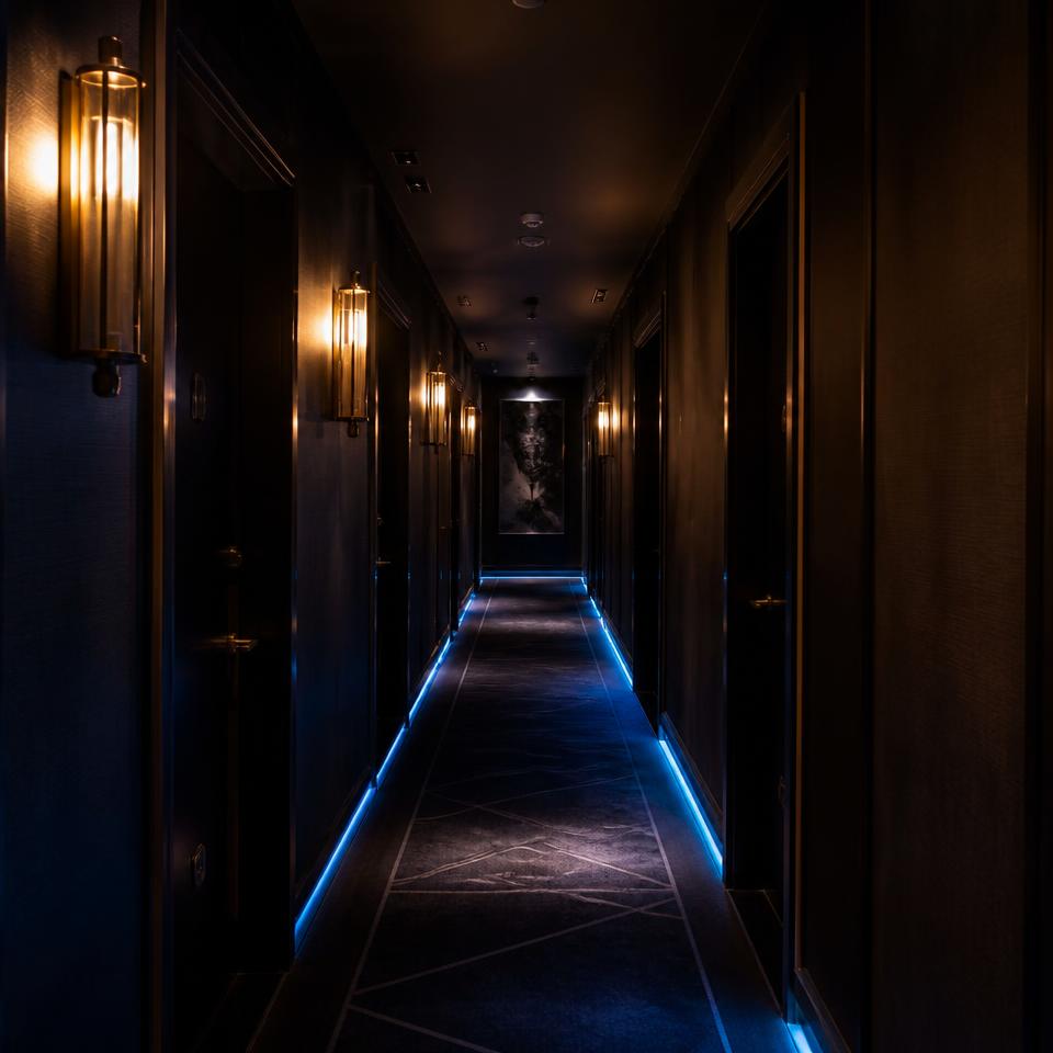 Neon-lit corridor to the Bree Sleep Over rooms above Cheeky Tiger Bree Street